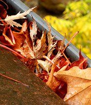 Power-Washing Contractor — Gutter Filled With Leaves in Fall River, MA Power-Washing Contractor — Gutter Filled With Leaves in Fall River, MA