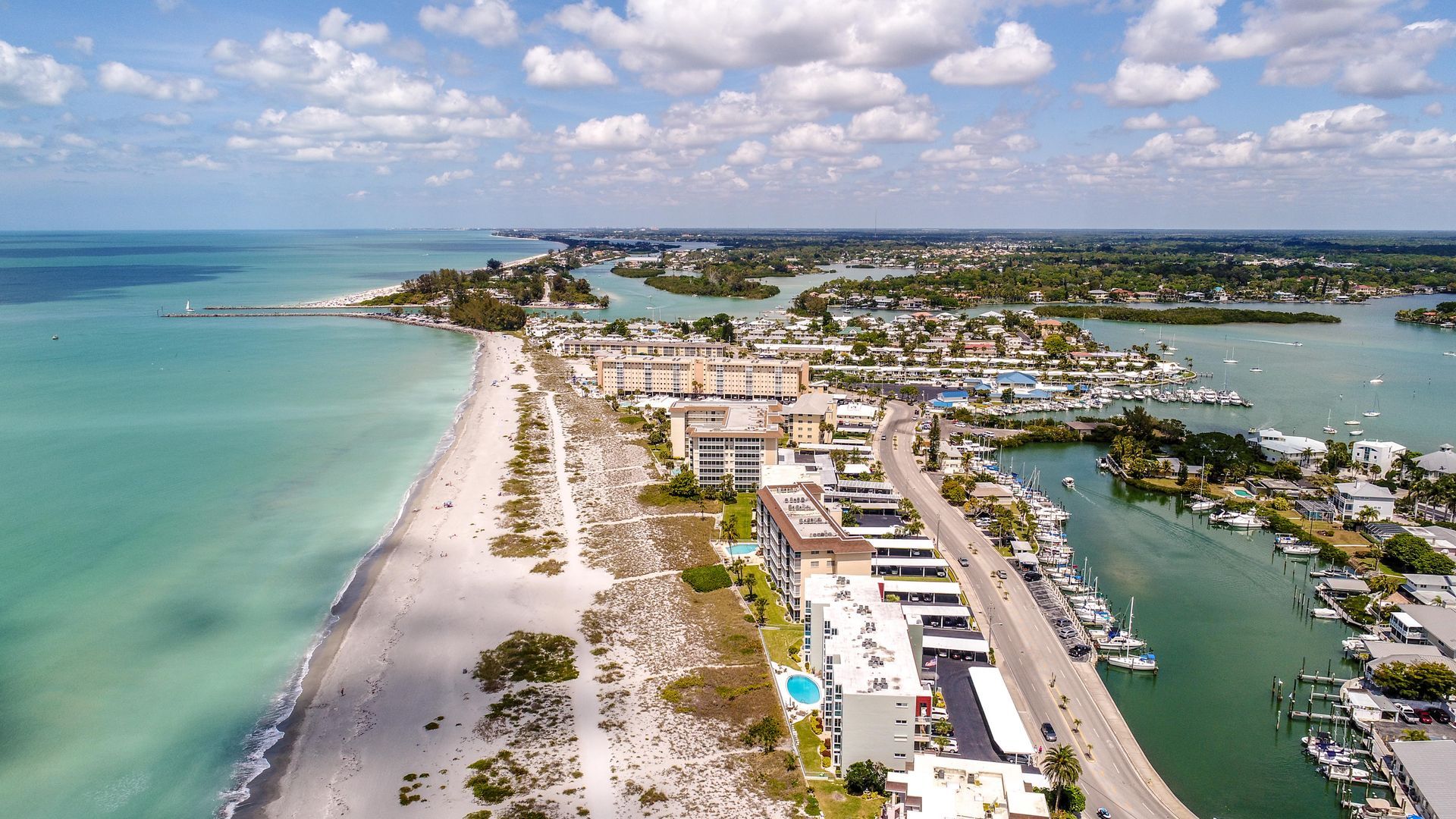 An aerial view of a city next to a body of water.