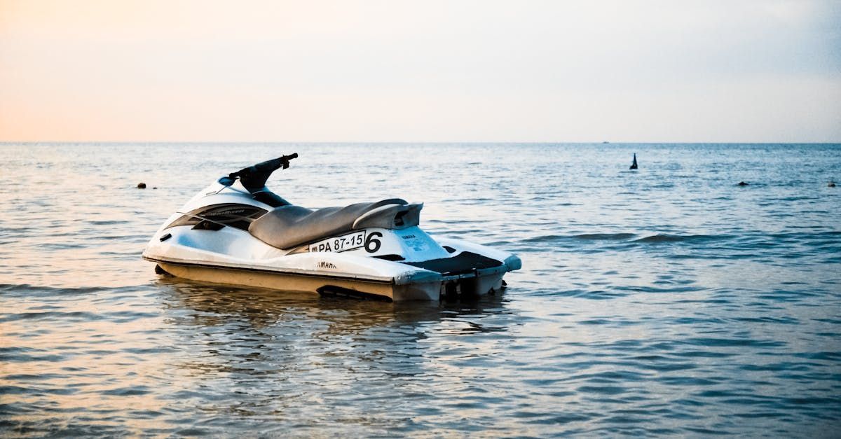A jet ski is floating on top of a body of water.