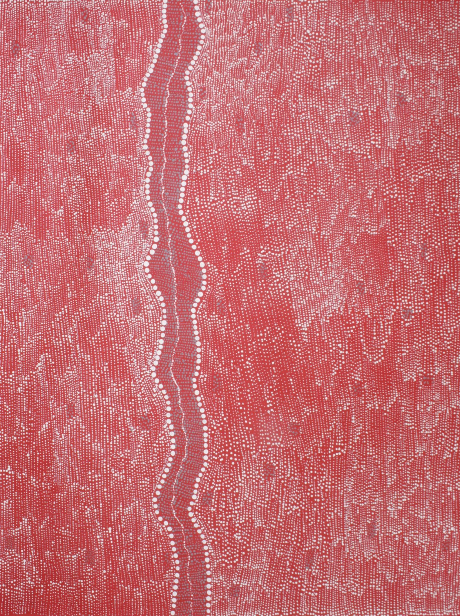 A close up of a red surface with a white stripe on it.