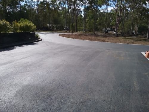 Wide Asphalt Driveway with Round-a-bout — Asphalt and Concreting Services and Solutions in Logan Village, QLD