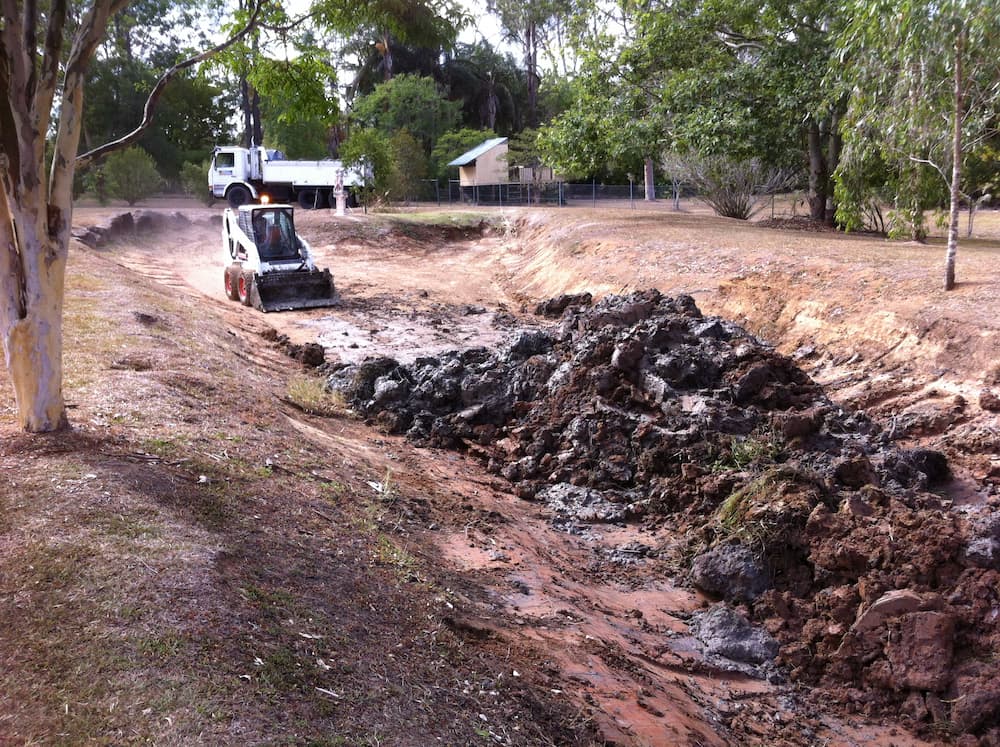 Mini Excavator Preparing Ground — Asphalt and Concreting Services and Solutions in Logan Village, QLD