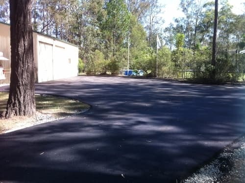 Asphalt Driveway at Residential House — Asphalt and Concreting Services and Solutions in Logan Village, QLD