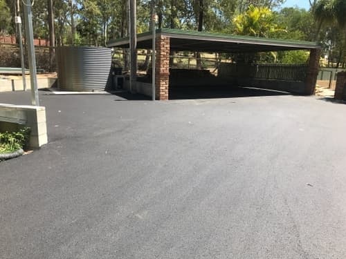 Asphalted Driveway & Carport — Asphalt and Concreting Services and Solutions in Logan Village, QLD
