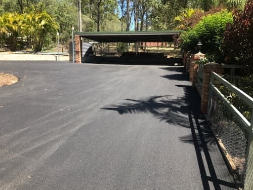 Fresh Asphalt on Driveway — Asphalt and Concreting Services and Solutions in Logan Village, QLD