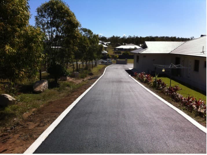 Residential Road After Asphalt — Asphalt and Concreting Services and Solutions in Logan Village, QLD