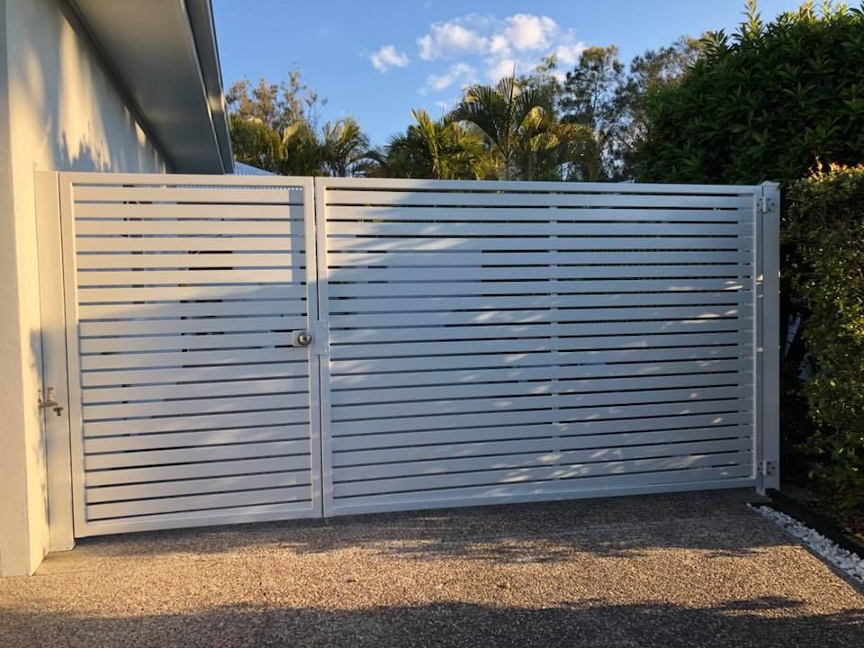 A White Gate is Sitting in Front of a House — Sunshine Gates in Caloundra, QLD