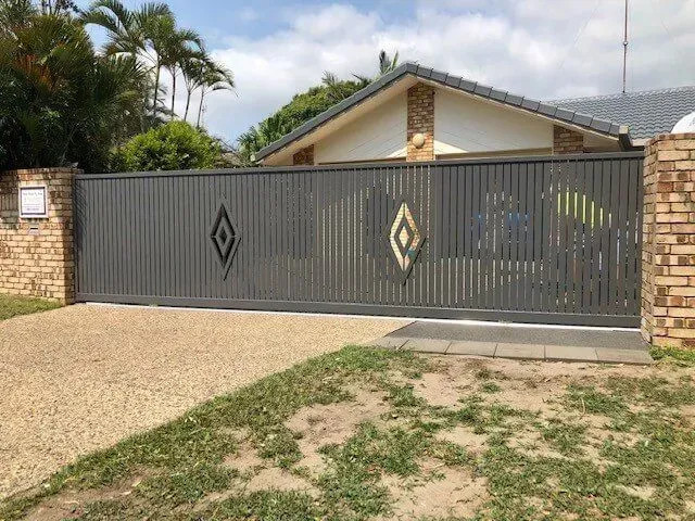 A house with a sliding gate in front of it.— Sunshine Gates in Kunda Park, QLD