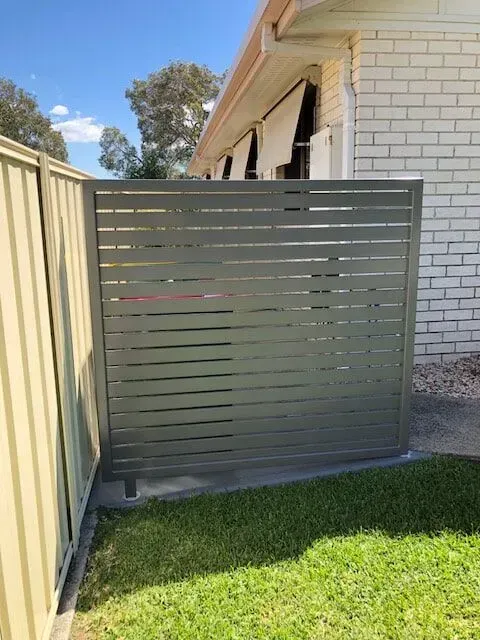 A house with a fence and a lawn in front of it. — Sunshine Gates in Kunda Park, QLD