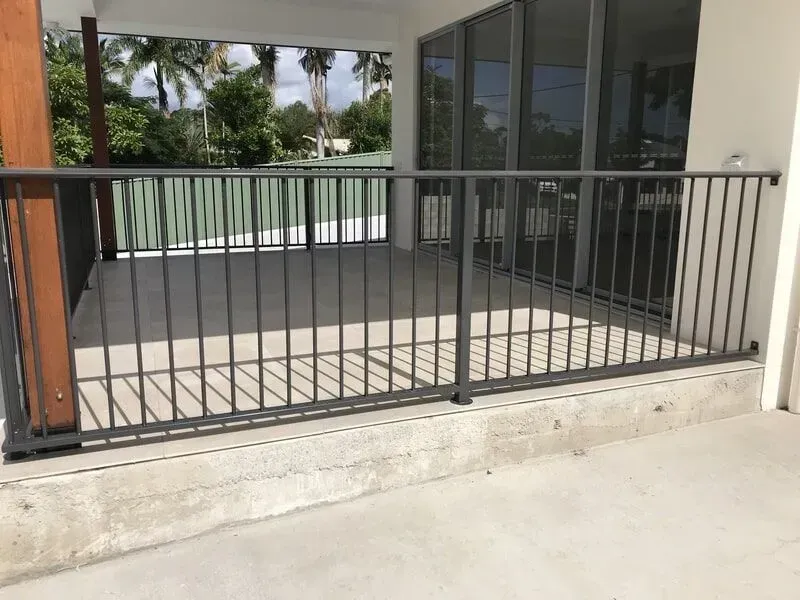 A balcony with a metal railing and a concrete floor. — Sunshine Gates in Kunda Park, QLD
