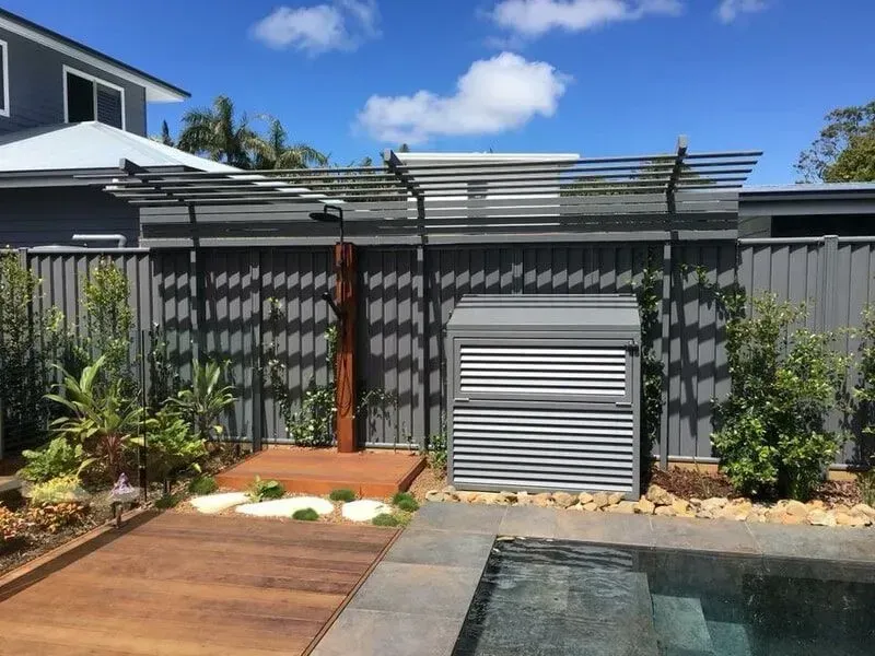 A house with a fence and a pool in front of it. — Sunshine Gates in Kunda Park, QLD