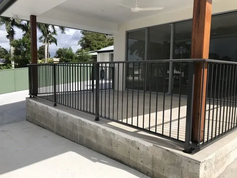 A balcony with a metal railing and a ceiling fan. — Sunshine Gates in Kunda Park, QLD