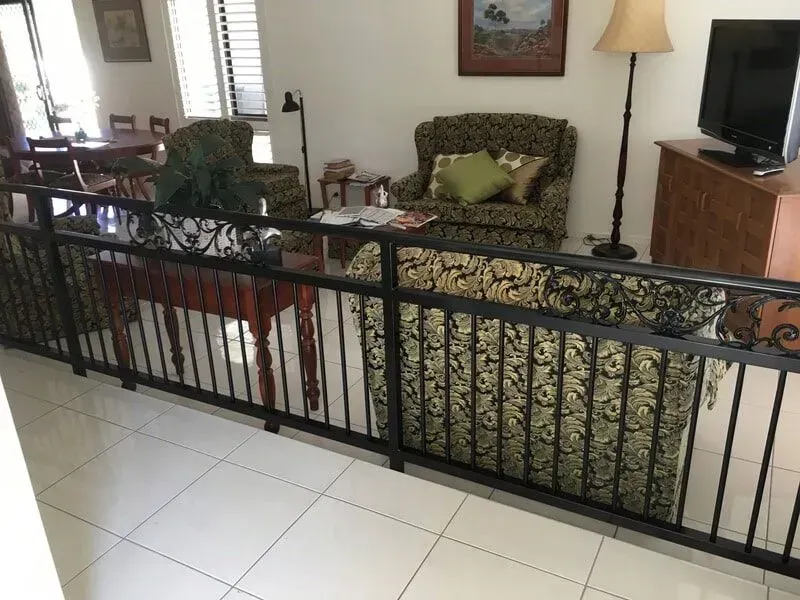 A living room with a couch a chair and a television. — Sunshine Gates in Kunda Park, QLD
