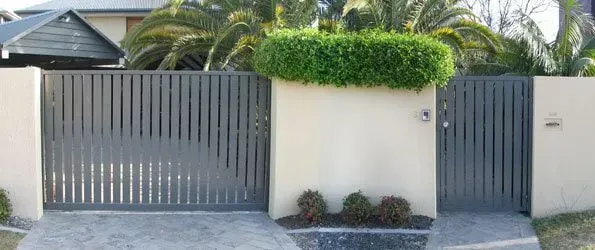 A house with a fence and a gate in front of it. — Sunshine Gates in Kunda Park, QLD