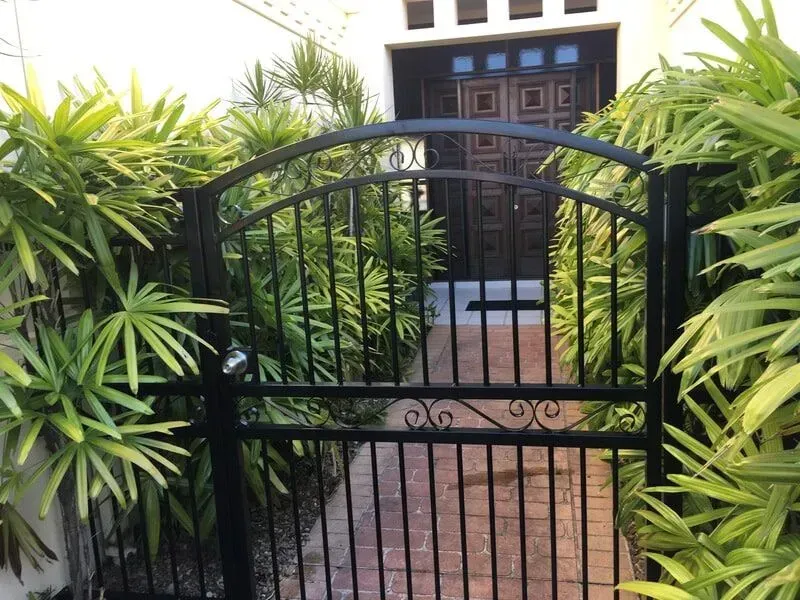 A Black Gate is Open to a Sidewalk in Front of a House — Sunshine Gates in Kunda Park, QLD