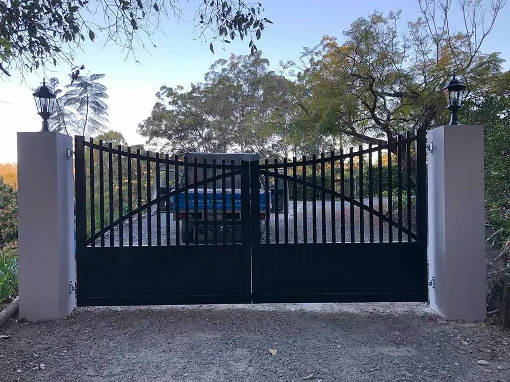A black gate with a blue car parked behind it. — Sunshine Gates in Kunda Park, QLD