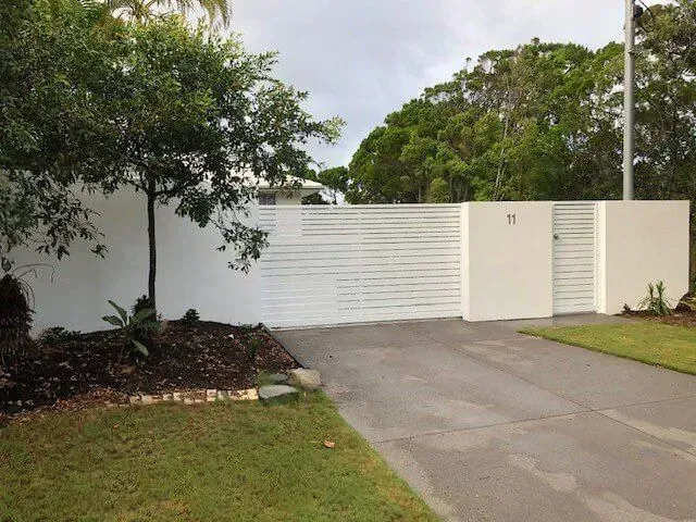 A white fence with the number 71 on it — Sunshine Gates in Kunda Park, QLD