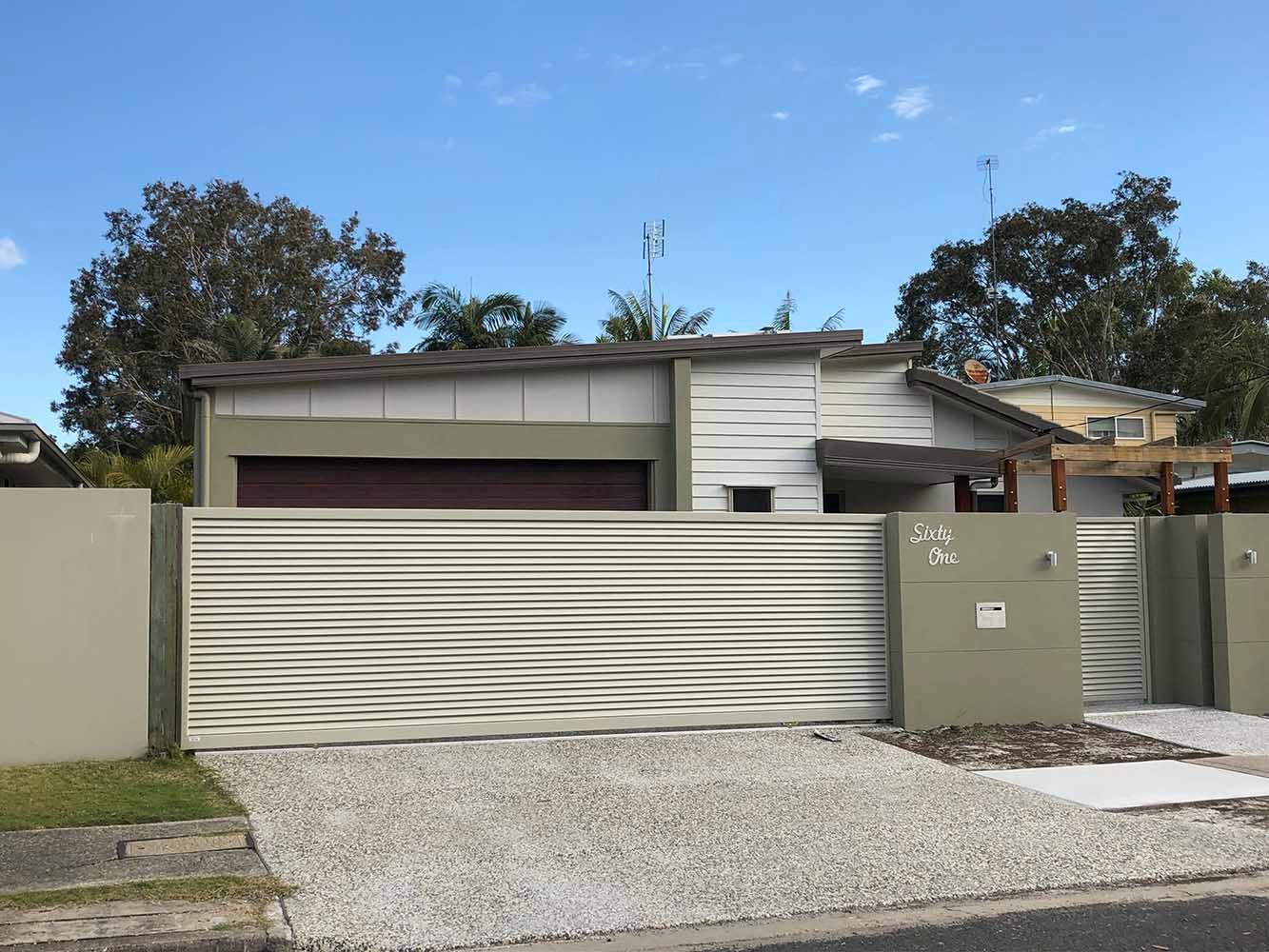 A house with a sliding gate in front of it. — Sunshine Gates in Kunda Park, QLD