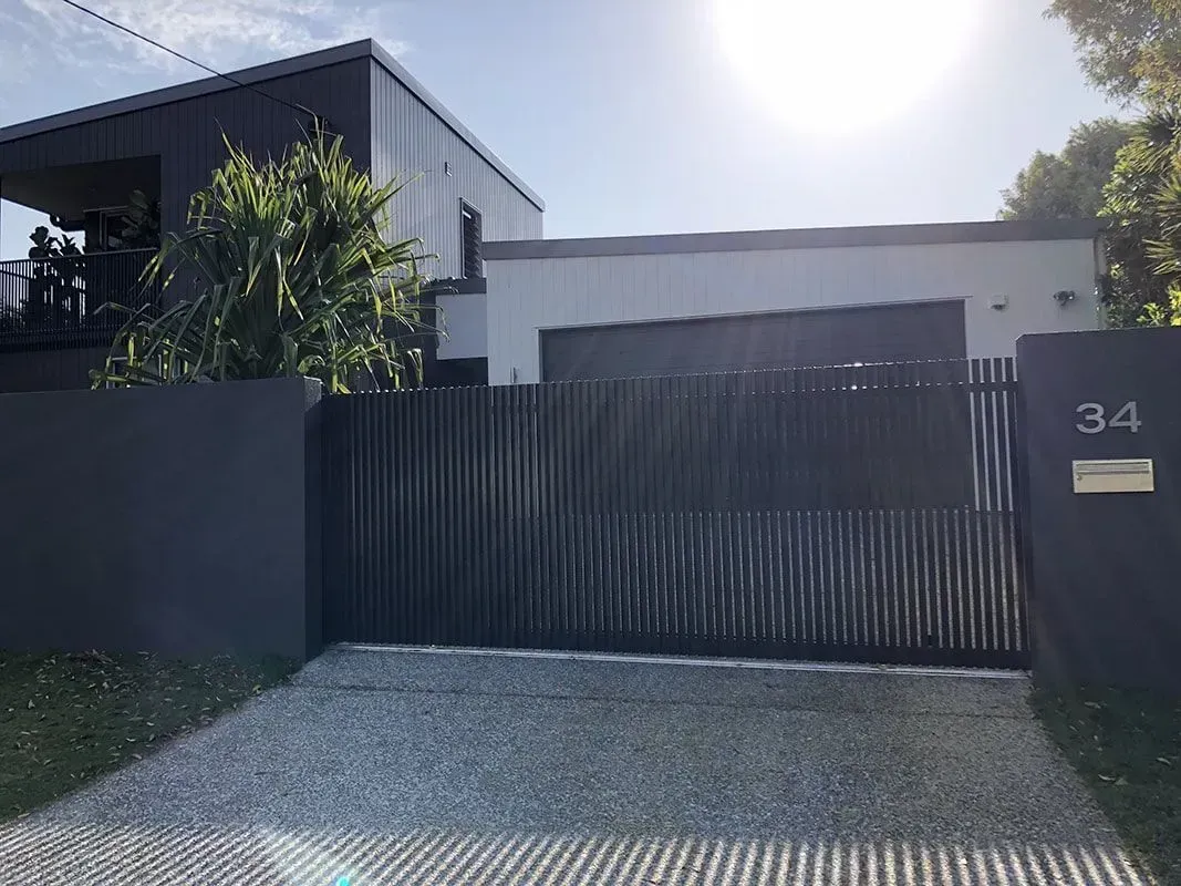 A house with a sliding gate and a mailbox in front of it. — Sunshine Gates in Kunda Park, QLD