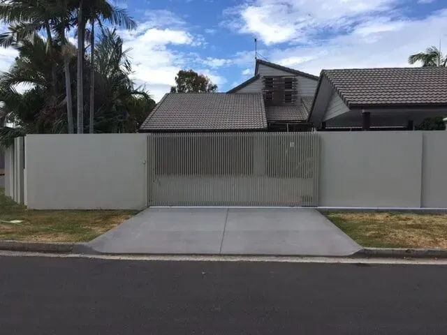 A house with a fence and a driveway in front of it. — Sunshine Gates in Kunda Park, QLD