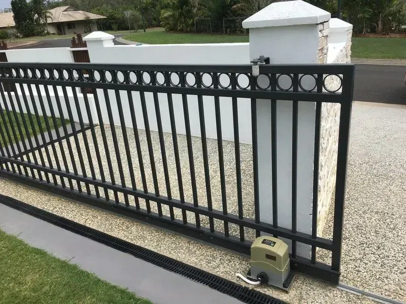 A sliding gate with a motor attached to it. — Sunshine Gates in Kunda Park, QLD