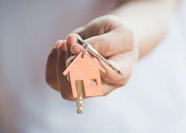 Hand holding a key — Reliable Conveyancer in Parap, NT