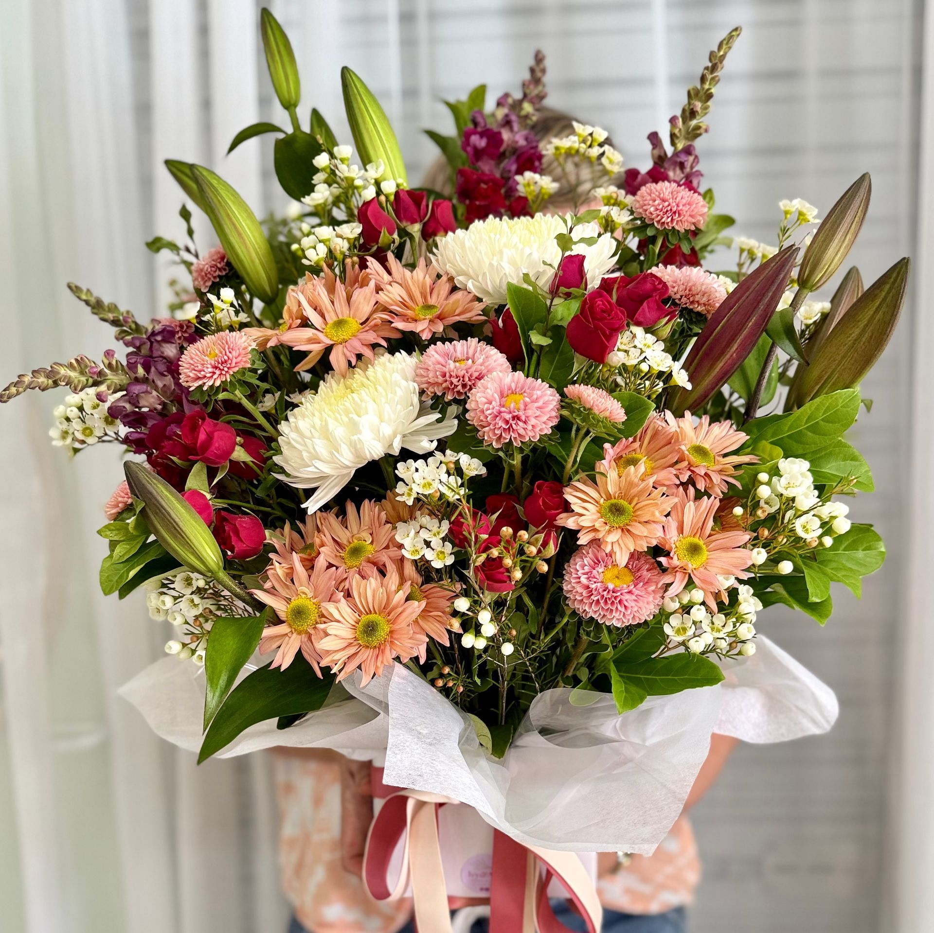 A Bunch Of Flowers Are Sitting On Top Of A Table — Ivy & Ash Flowers & Gifts in Palmview, QLD