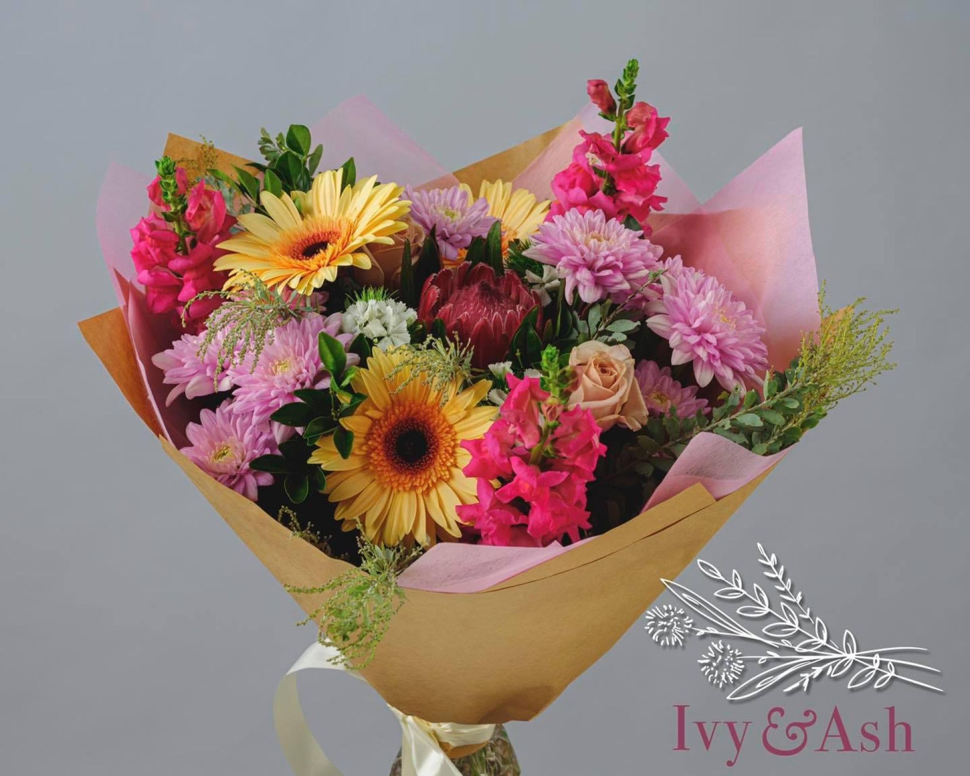 A Bunch Of Flowers Are Sitting On A Table In A Room — Ivy & Ash Flowers & Gifts in Palmview, QLD