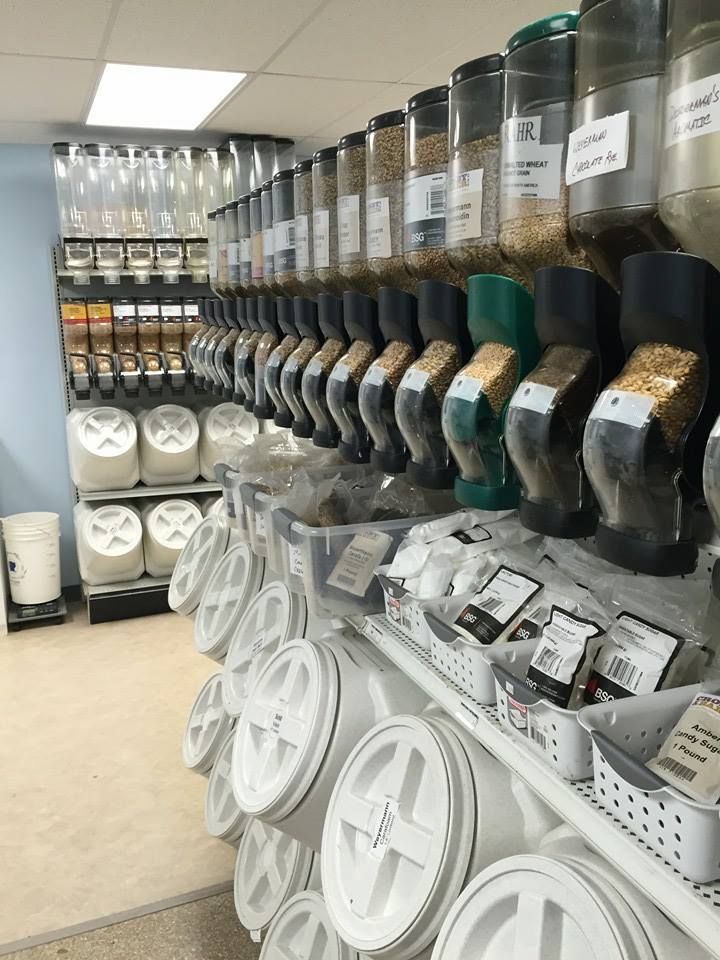 A store filled with lots of containers of grains.