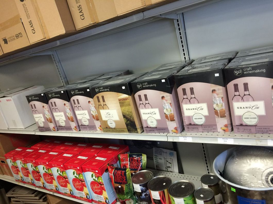 A store shelf filled with boxes and cans of food