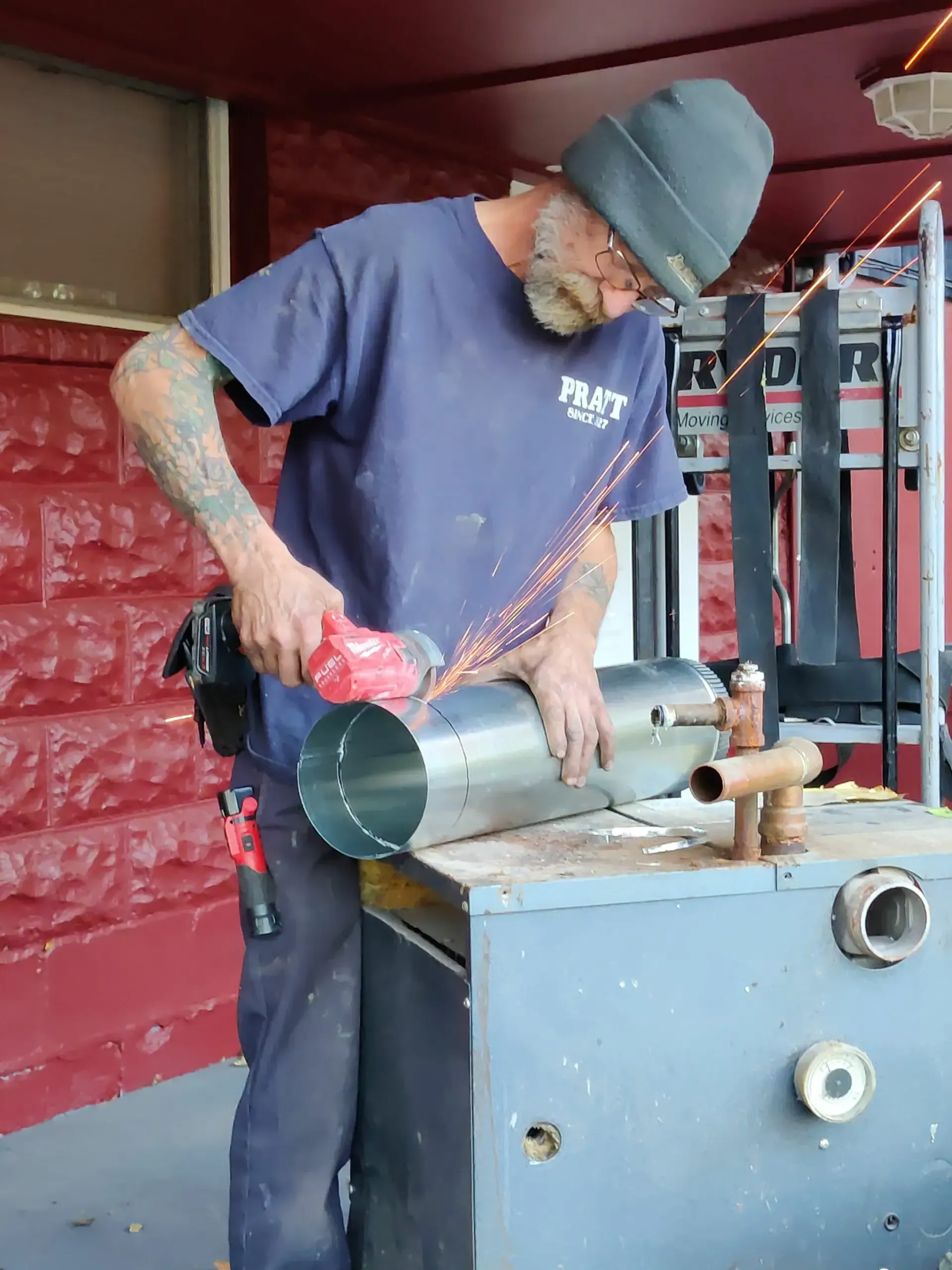 A man wearing a blue shirt that says ' rust ' on it