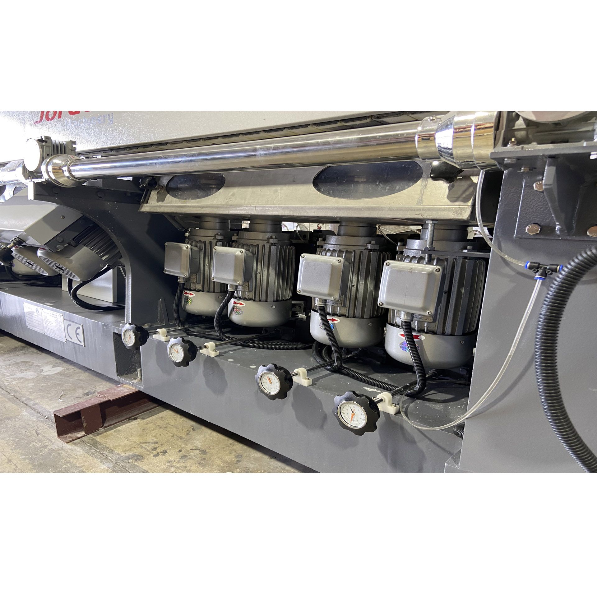 A machine with a lot of motors on it is sitting on a table.