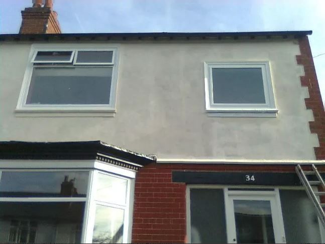 the front of a house repainted