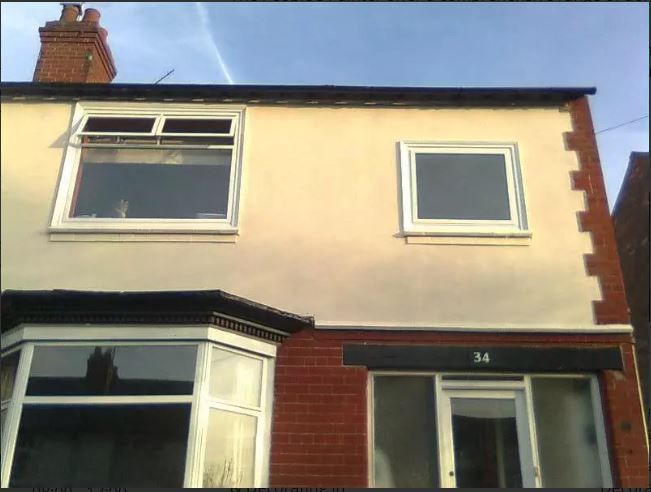 a house exterior repaint completed