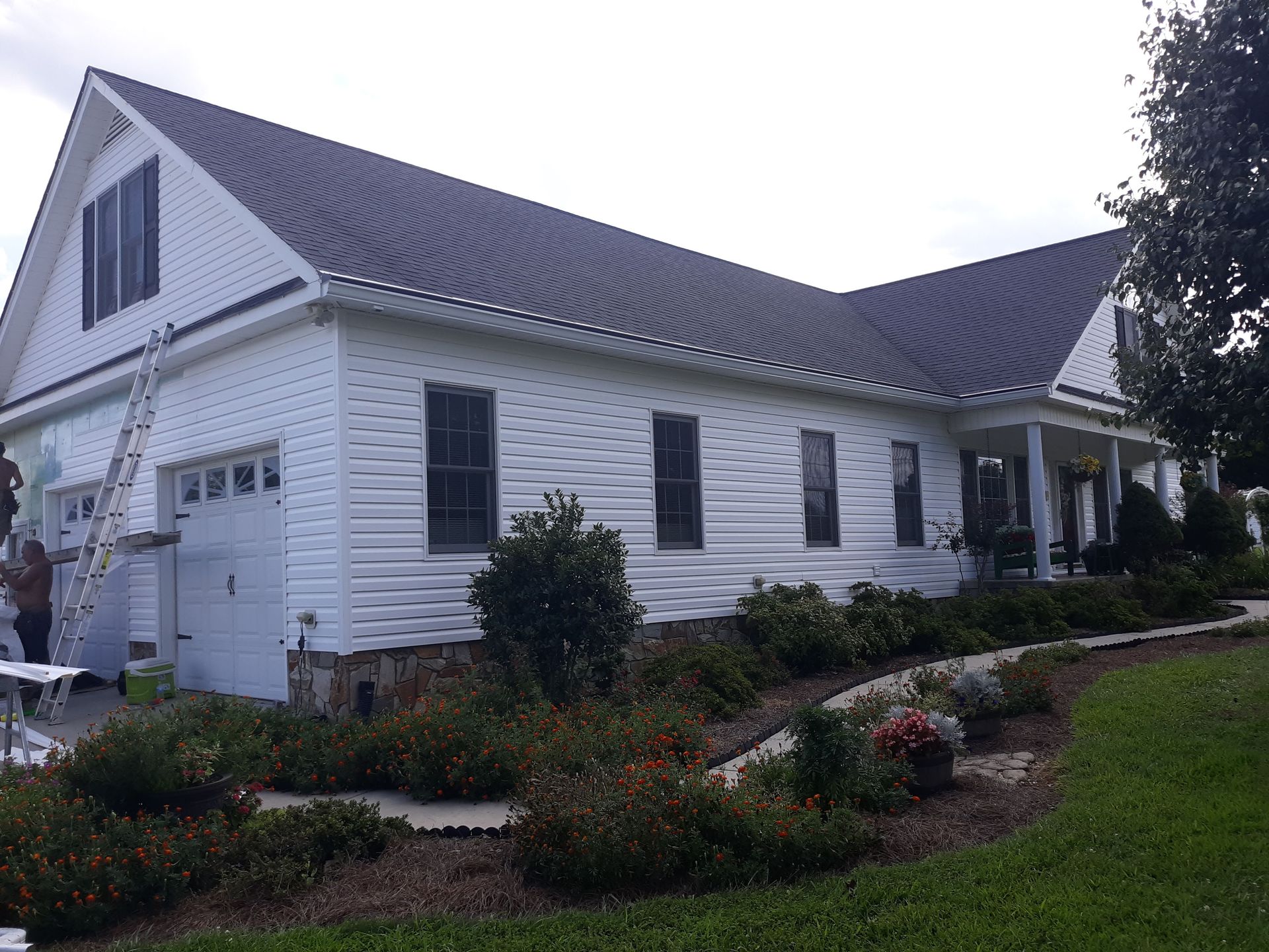 A close up of a blue siding on a house
