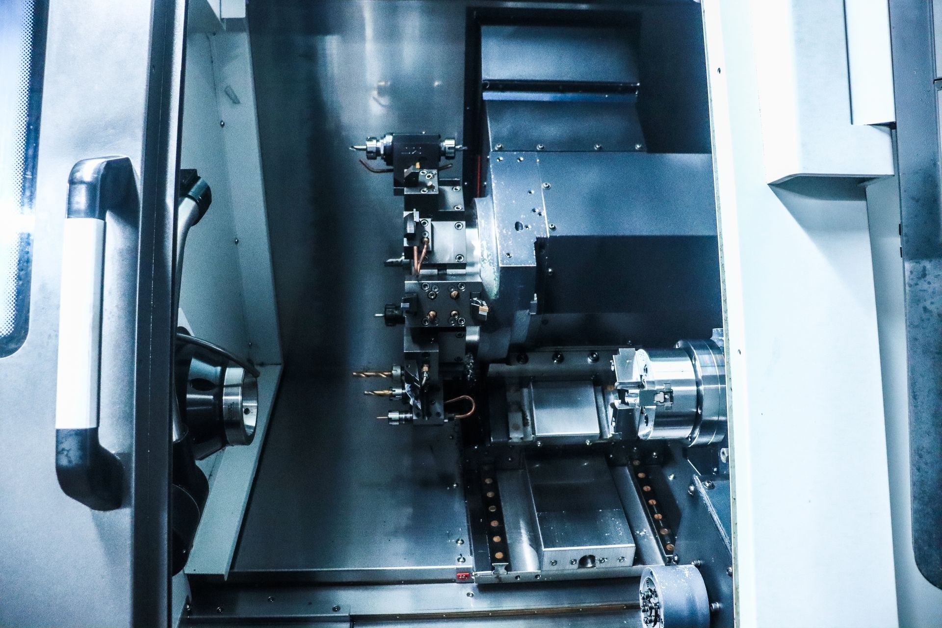 A machine is being used to make a piece of metal