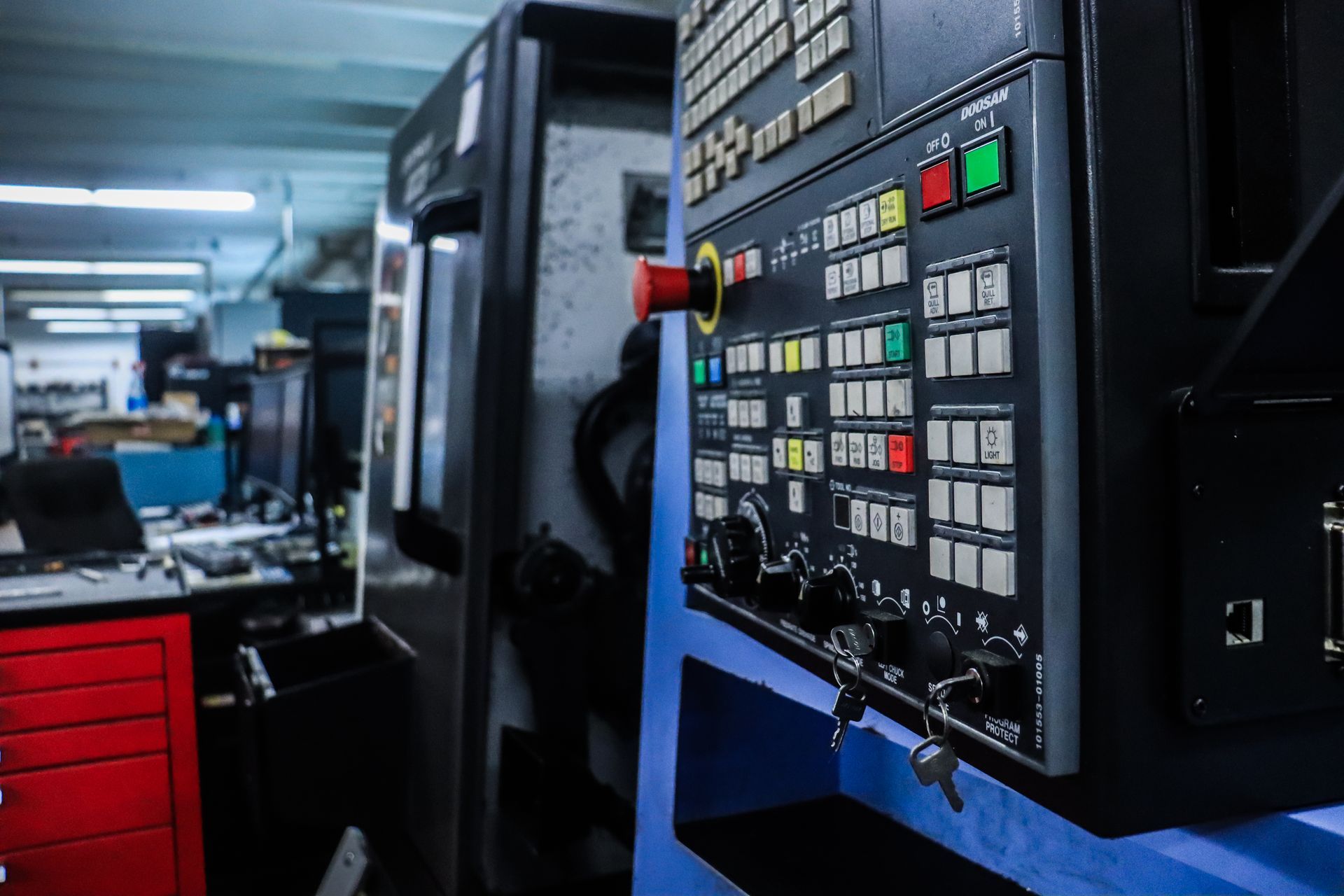 A close up of a machine control panel in a factory.