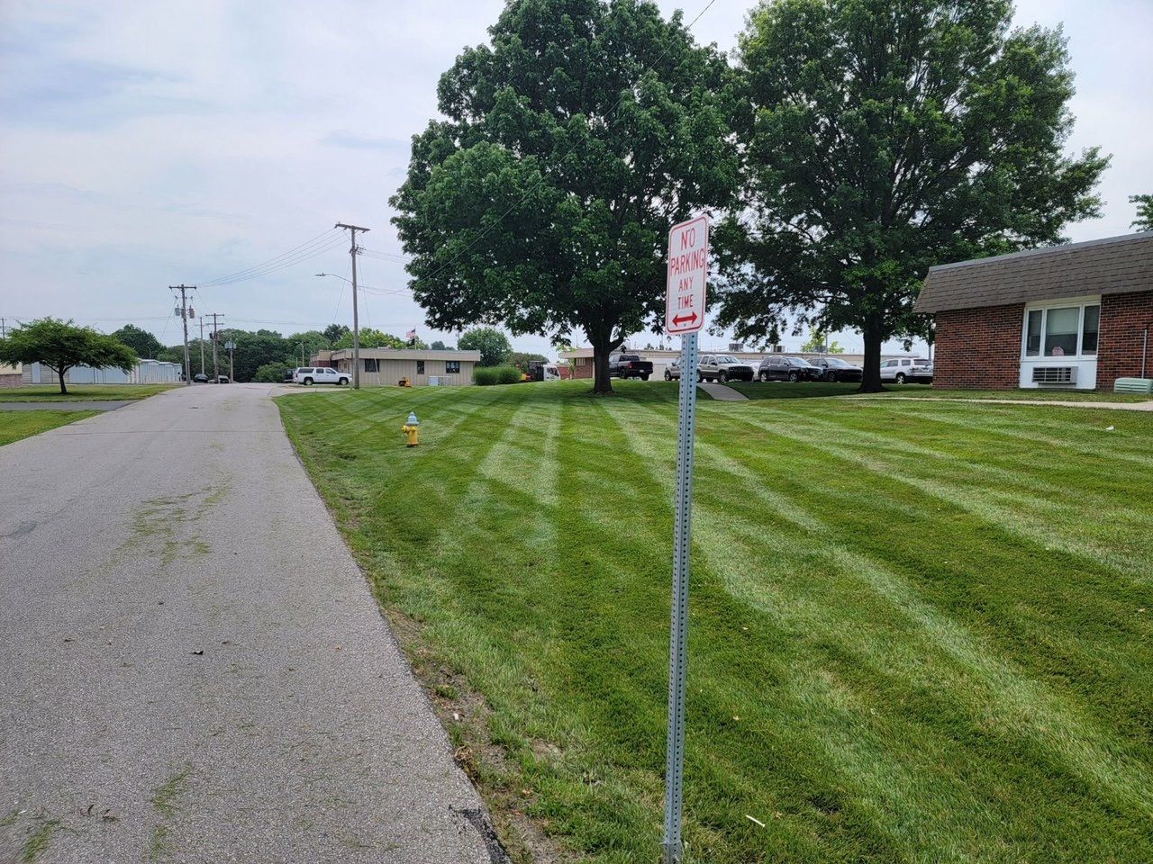 There is a no parking sign on the side of the road.