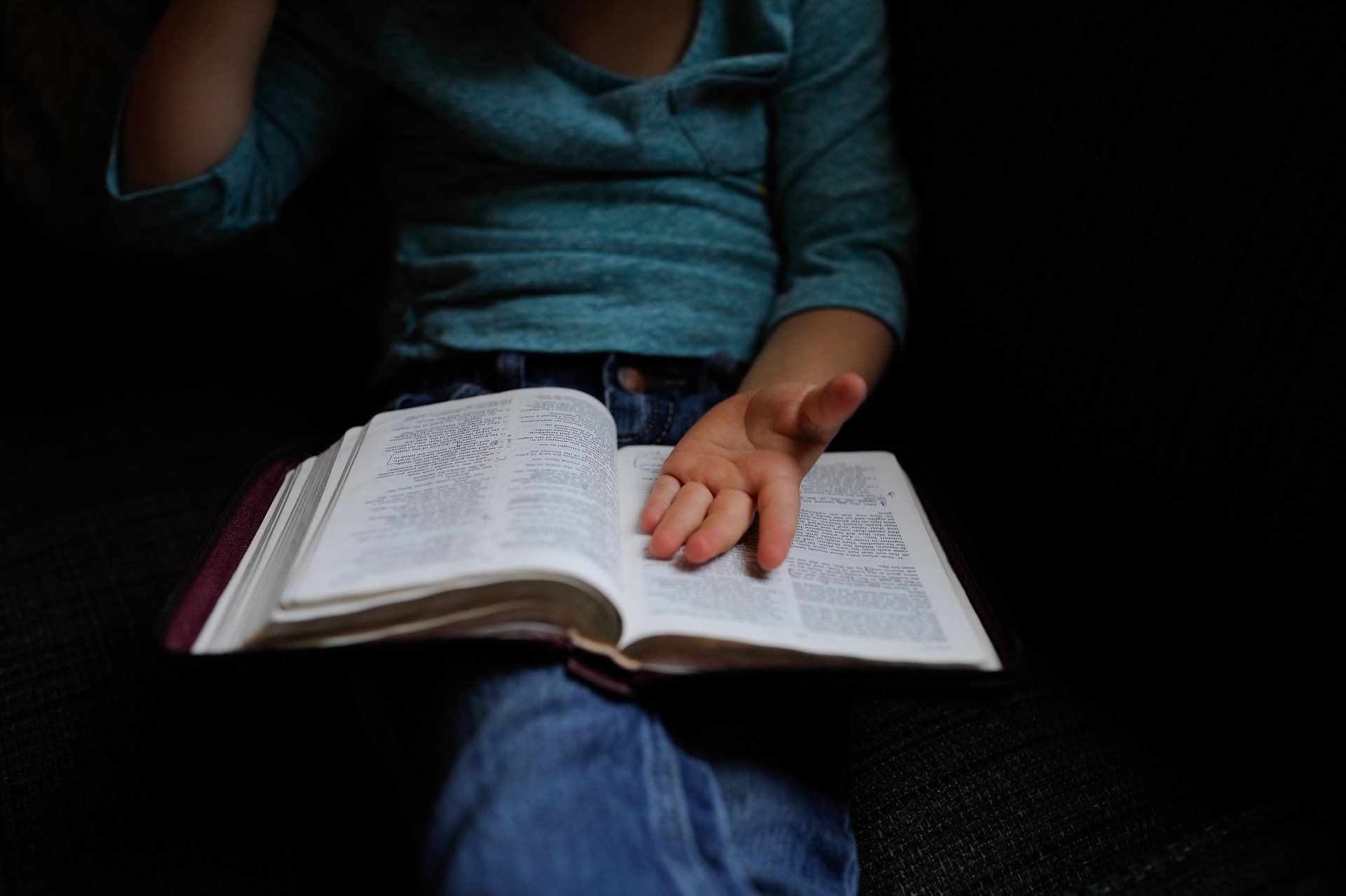 Photograph of Young Woman Holding Bible