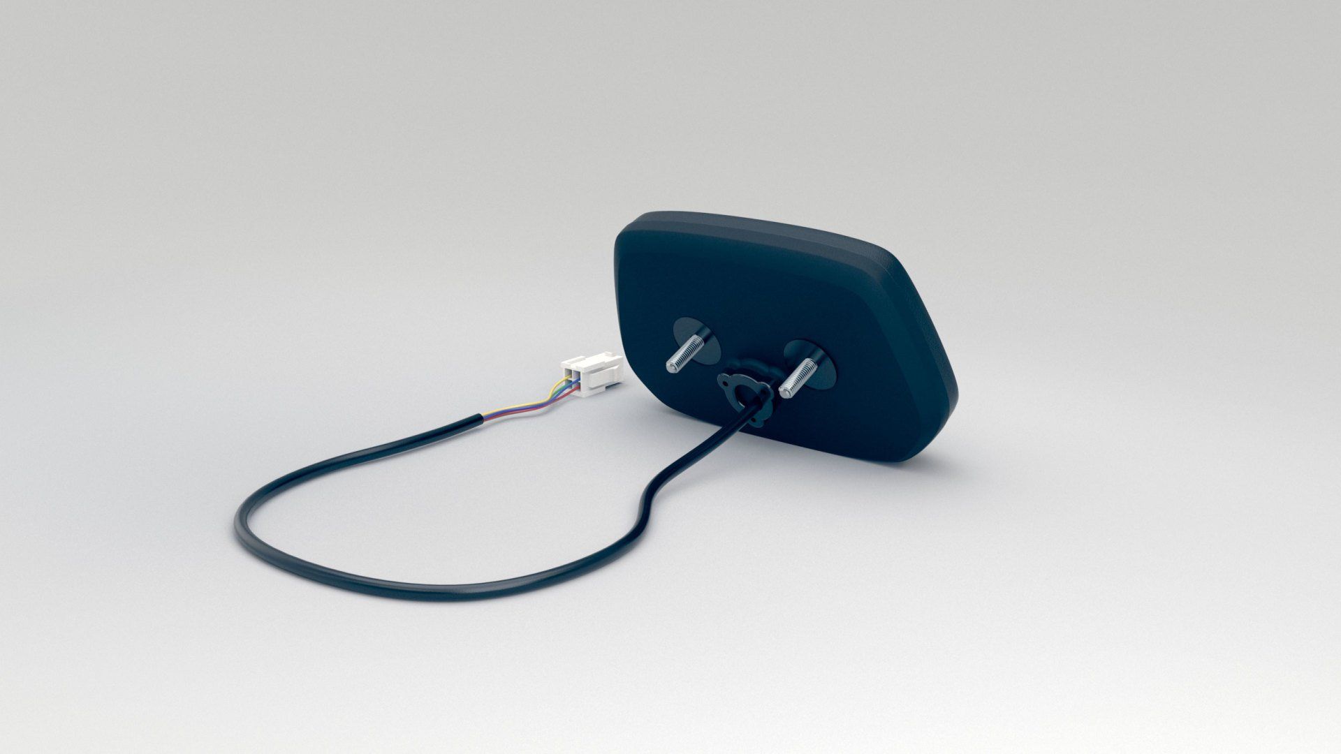 A black object with a cord attached to it on a white surface.