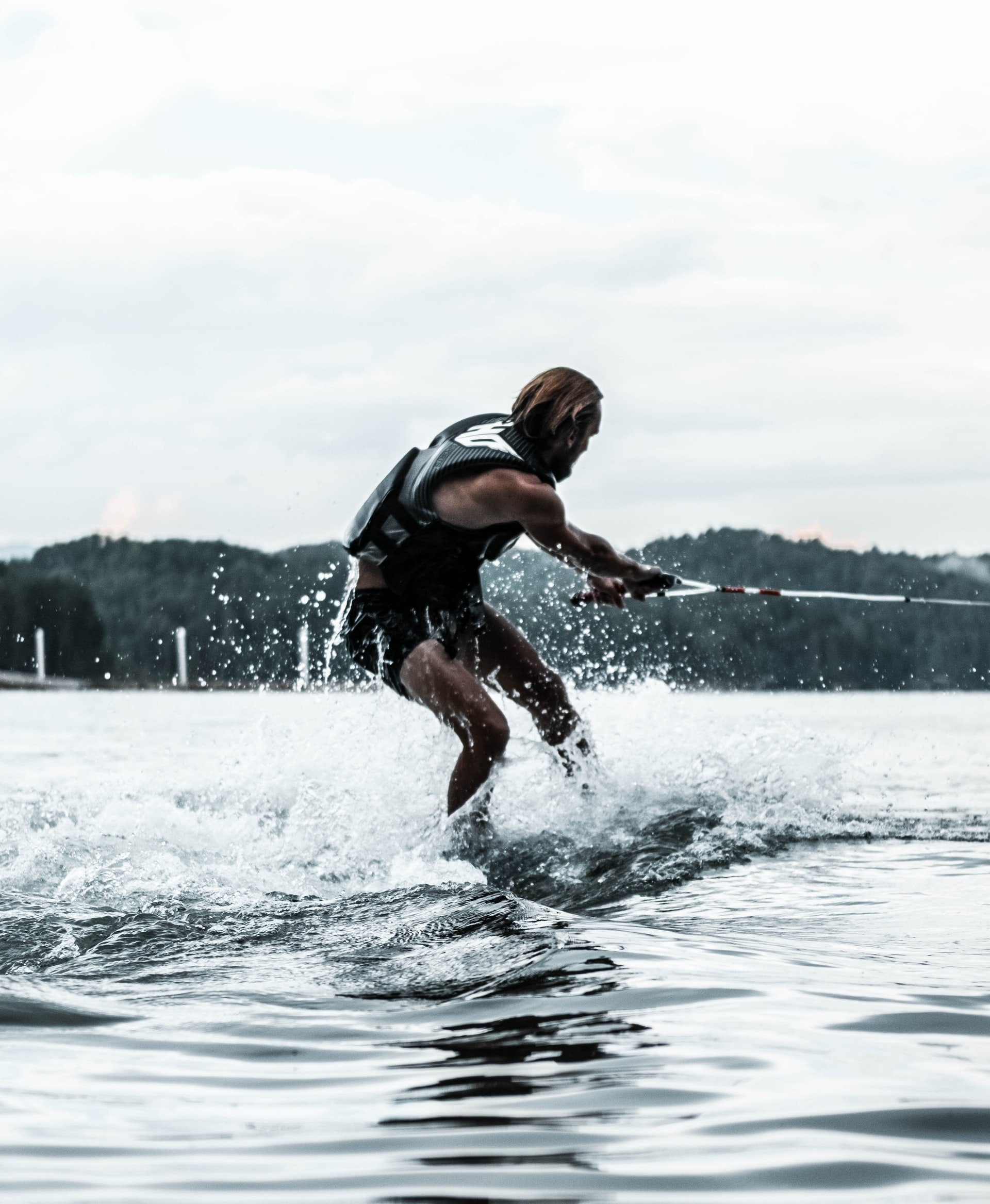A man is water skiing on a lake.