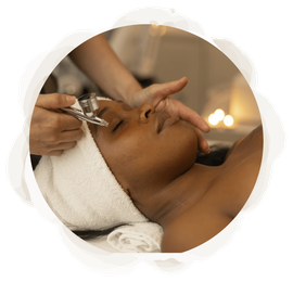 A woman is getting a facial treatment at a spa.
