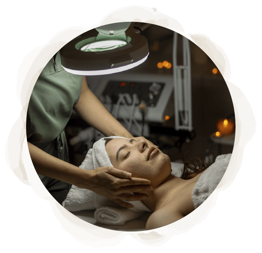 A woman is getting a facial treatment at a spa.
