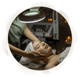 A woman is getting a facial treatment at a spa.