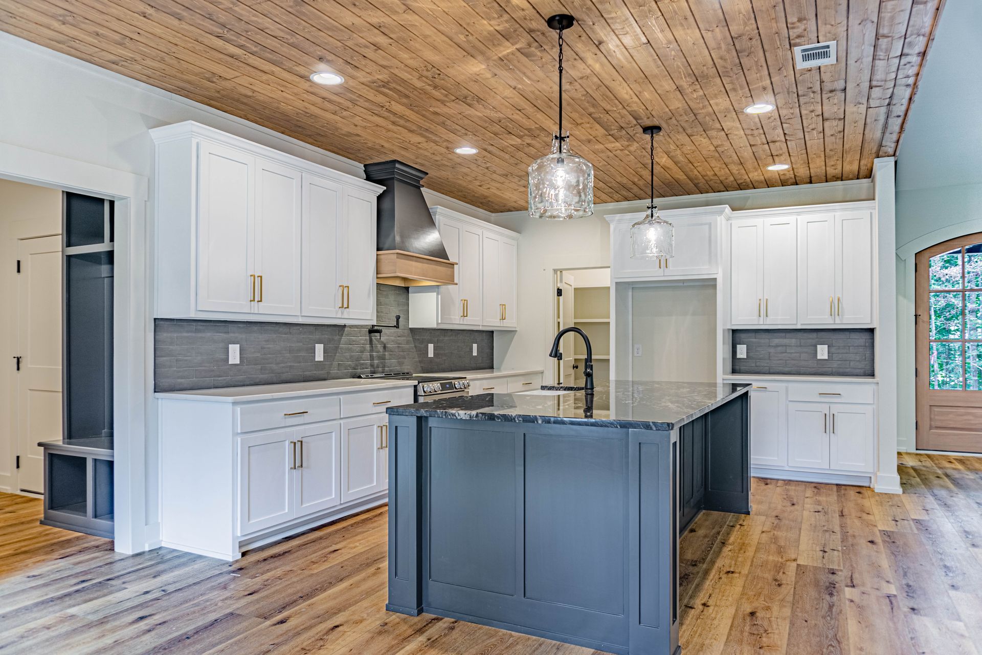 There is a large island in the middle of the kitchen.