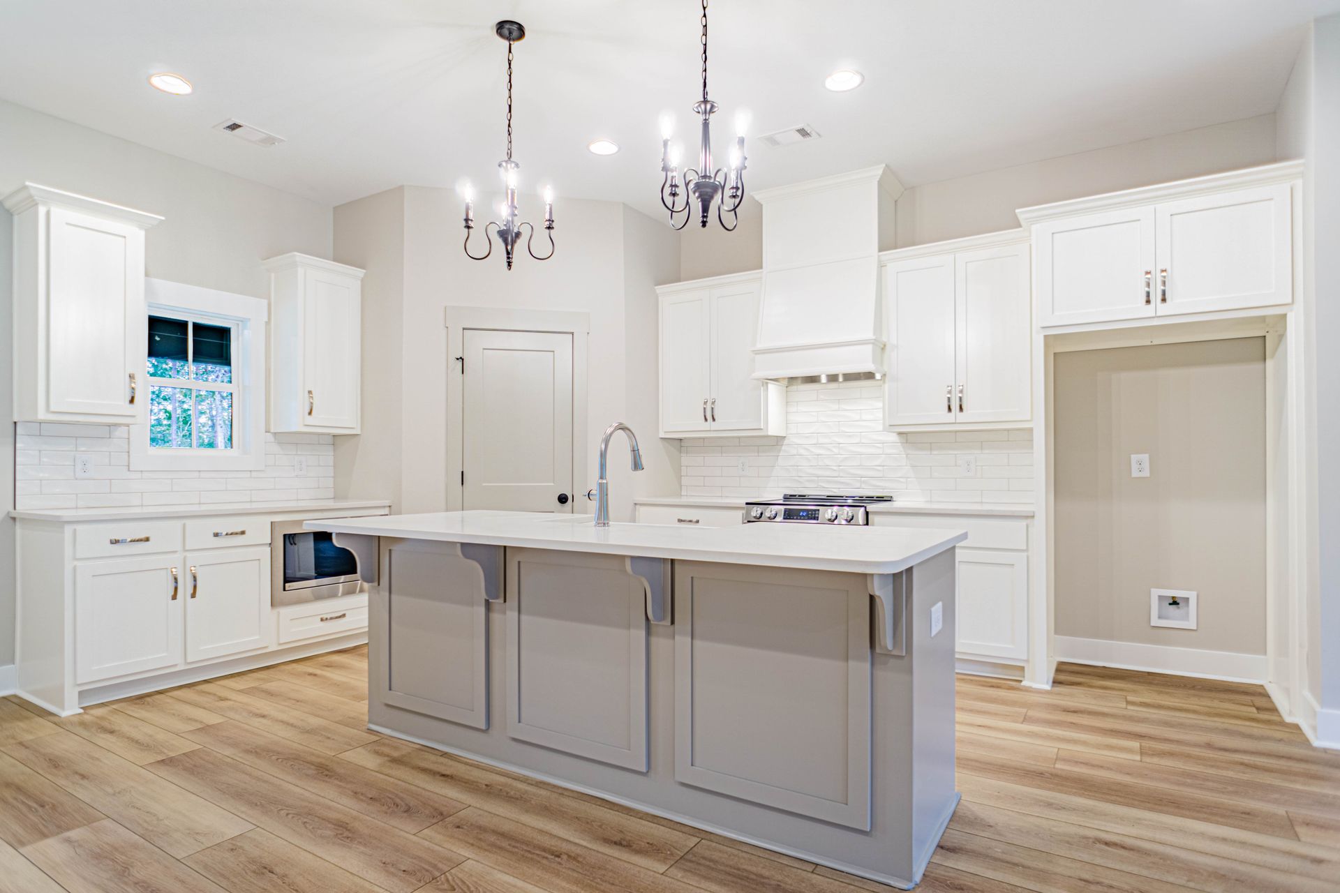 There is a large island in the middle of the kitchen.