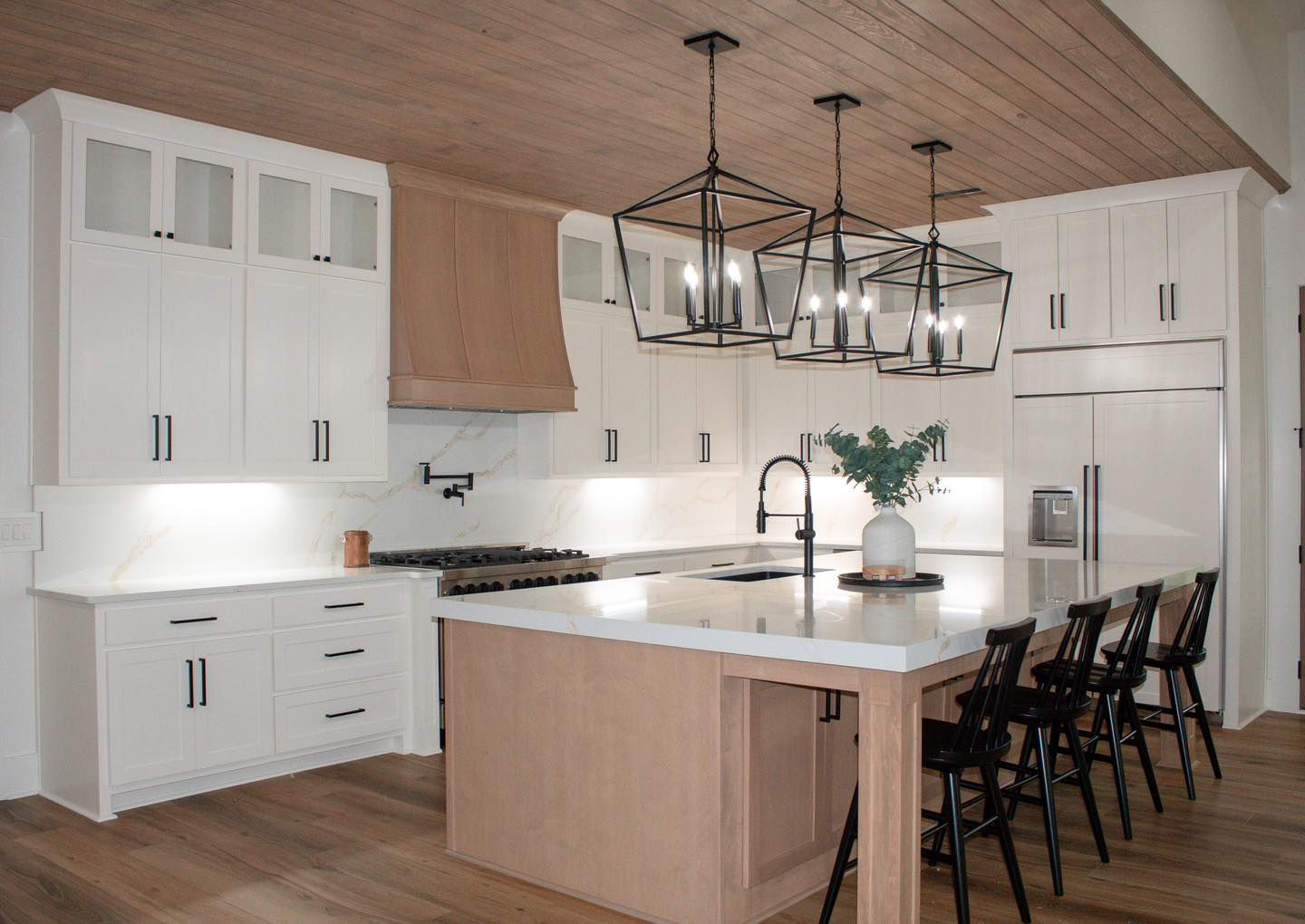 There is a large island in the middle of the kitchen.