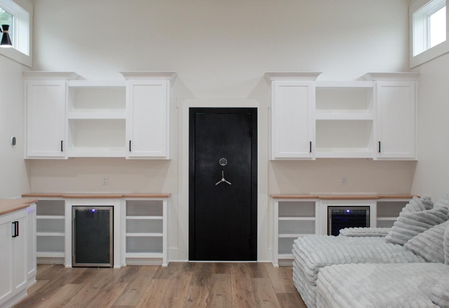 A living room with a couch and a safe.