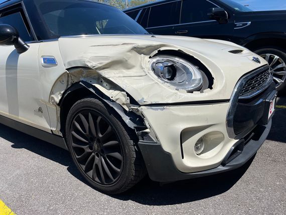 A damaged mini cooper.