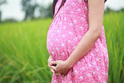 pregnant woman in a field